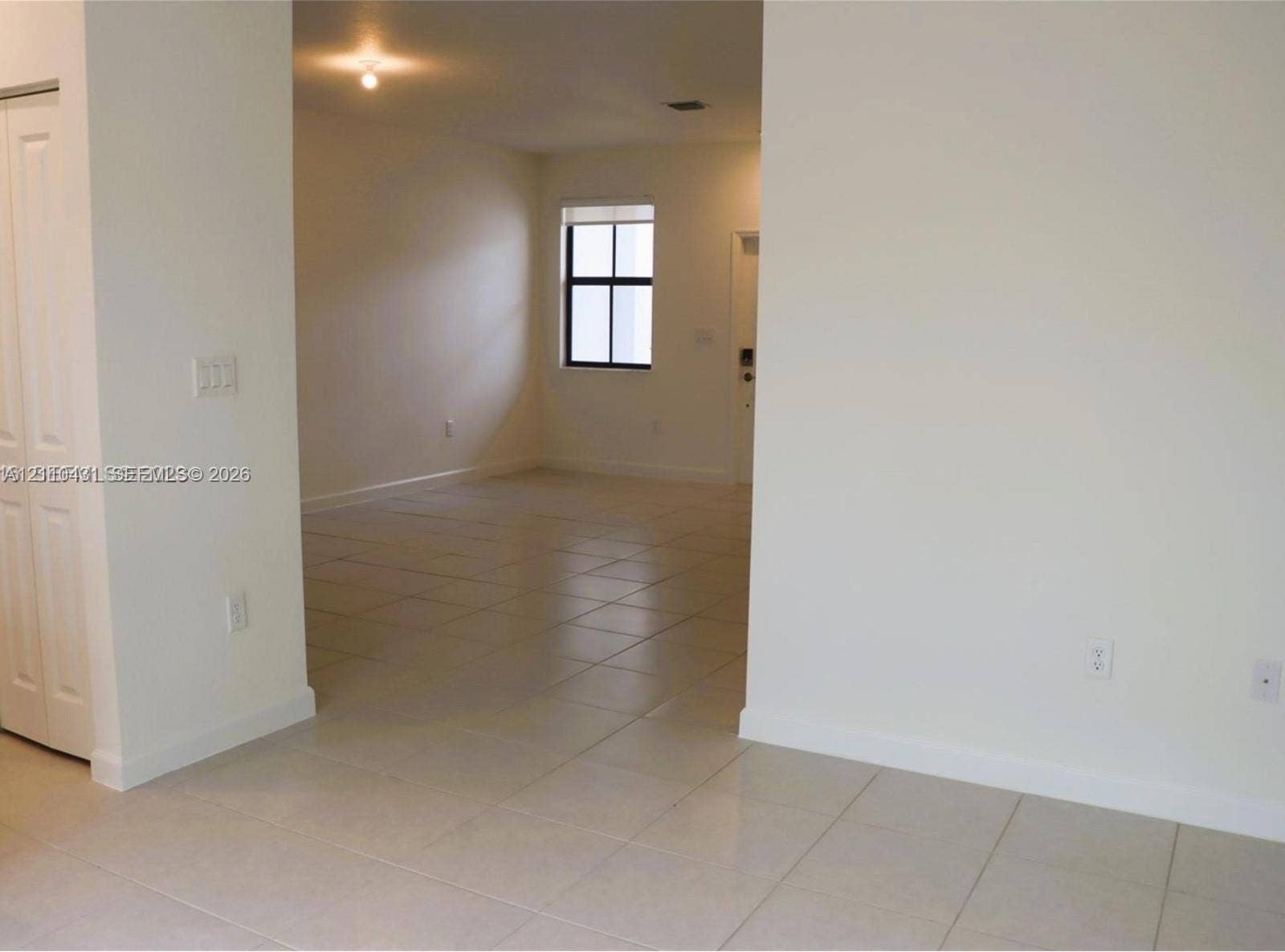 23452 SW 129th Avenue, Homestead, FL 33032 Neutral-toned ceramic tile flooring, interior closet with bi-fold doors, and recessed ceiling lighting