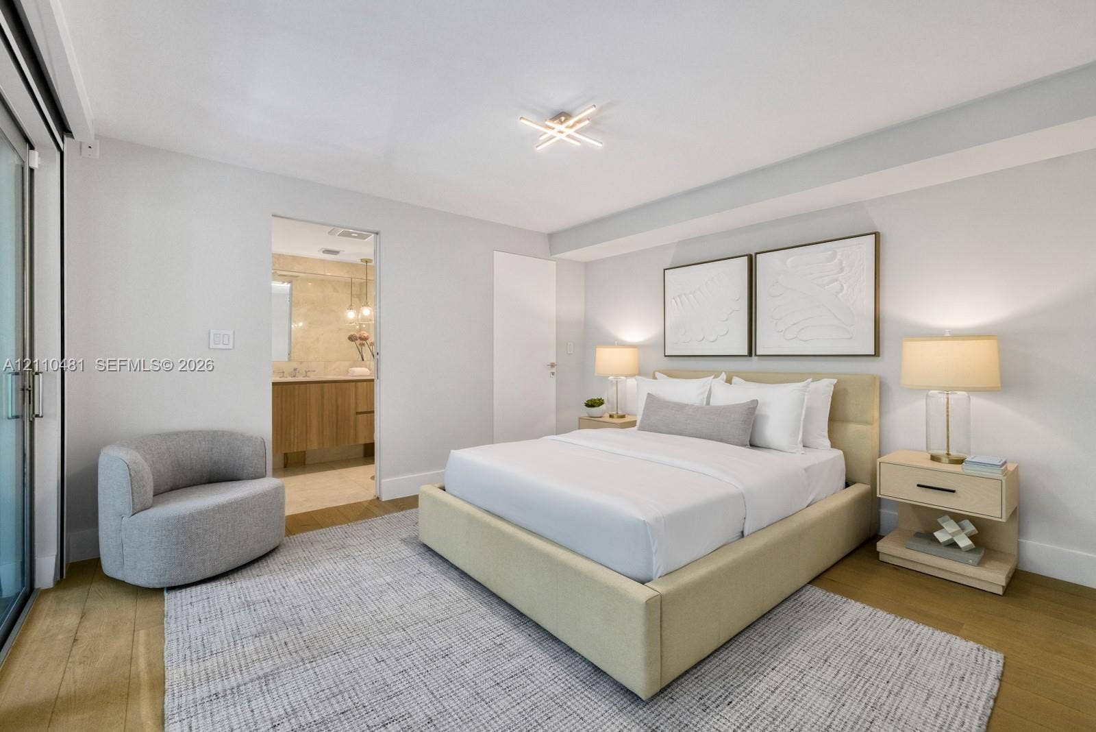 234 Washington Avenue, #D, Miami Beach, FL 33139 Wood-finish flooring, sliding glass door, and flush-mount geometric ceiling lighting