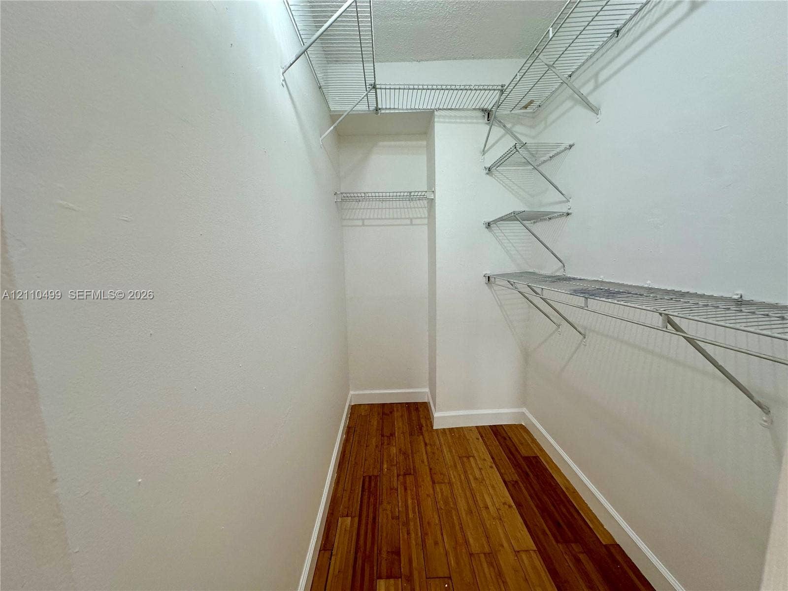 8145 NW 7th Street, #308, Miami, Miami, FL 33126 Storage space featuring wood-finish flooring and tiered wire shelving