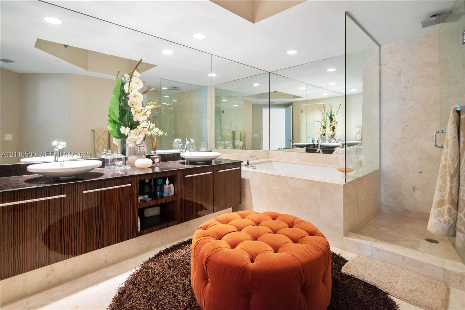 2711 S Ocean Drive, #2205, Hollywood, Hollywood, FL 33019 Floating vanity with dual vessel sinks and stone countertop, recessed lighting, expansive wall-to-wall mirror, built-in soaking tub with stone surround, and glass-enclosed walk-in shower