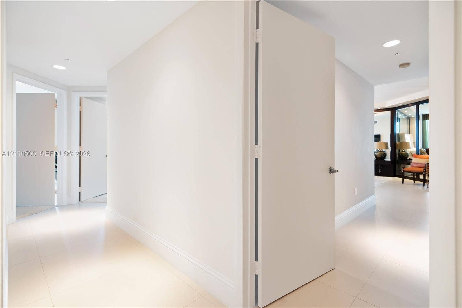 2711 S Ocean Drive, #2205, Hollywood, Hollywood, FL 33019 Interior hallway featuring large-format tile flooring, crisp neutral wall finishes, solid-core interior doors, and recessed ceiling lighting