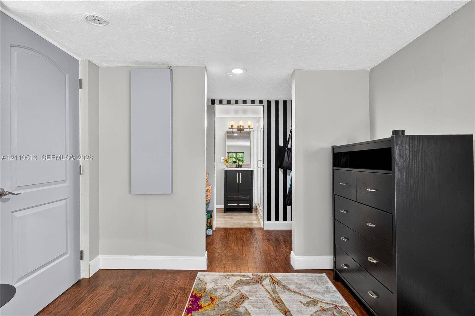 6520 SW 16th Terrace, West Miami, FL 33155 Interior space featuring wood-finish flooring, recessed lighting, and a solid-core panel door