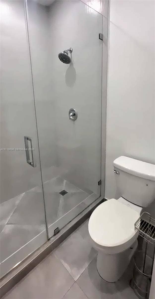 15677 SW 20 Street, #B, Miami, Miami, FL 33185 Glass-enclosed shower with polished chrome fixtures and tile flooring