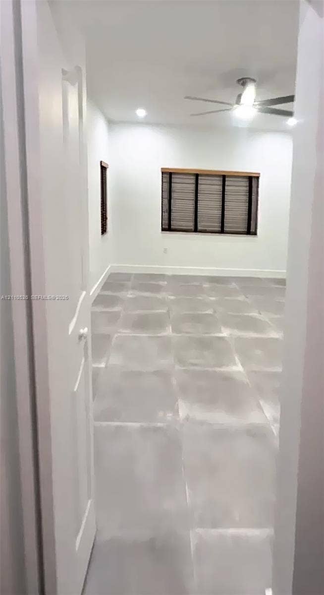 15677 SW 20 Street, #B, Miami, Miami, FL 33185 Interior space featuring large-format tile flooring, recessed ceiling lighting, and a multi-blade ceiling fan with integrated light fixture