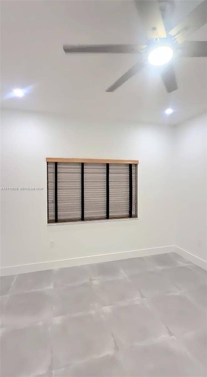 15677 SW 20 Street, #B, Miami, Miami, FL 33185 Interior room featuring large-format tile flooring, recessed lighting, and a multi-blade ceiling fan with an integrated light fixture