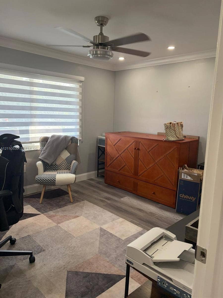 13255 SW 16th Court, #K112, Pembroke Pines, FL 33027 Room featuring neutral wall paint, wood-finish flooring, recessed lighting, and a modern ceiling fan with an integrated light fixture