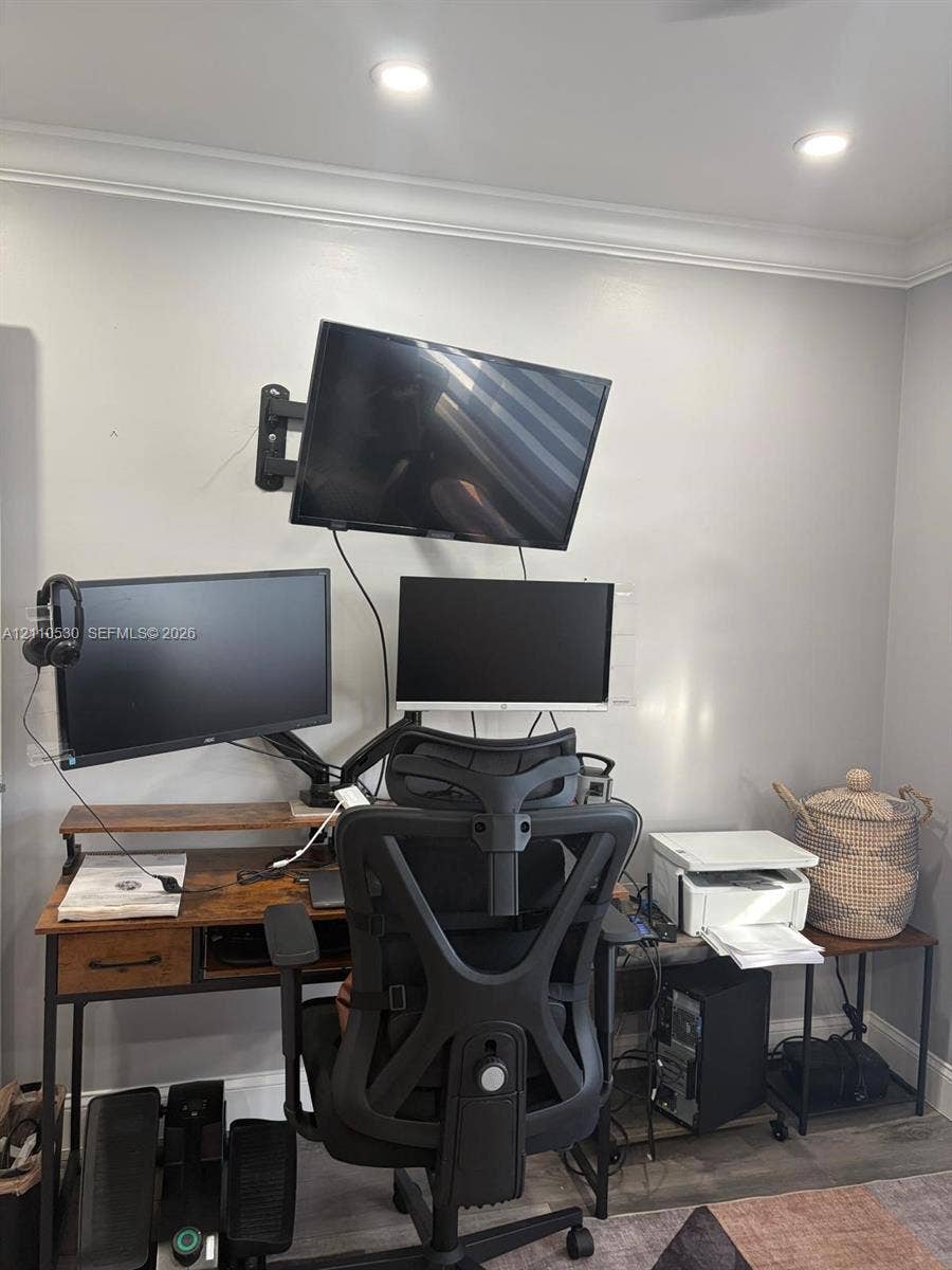 13255 SW 16th Court, #K112, Pembroke Pines, FL 33027 Wall-mounted television bracket and recessed ceiling lighting