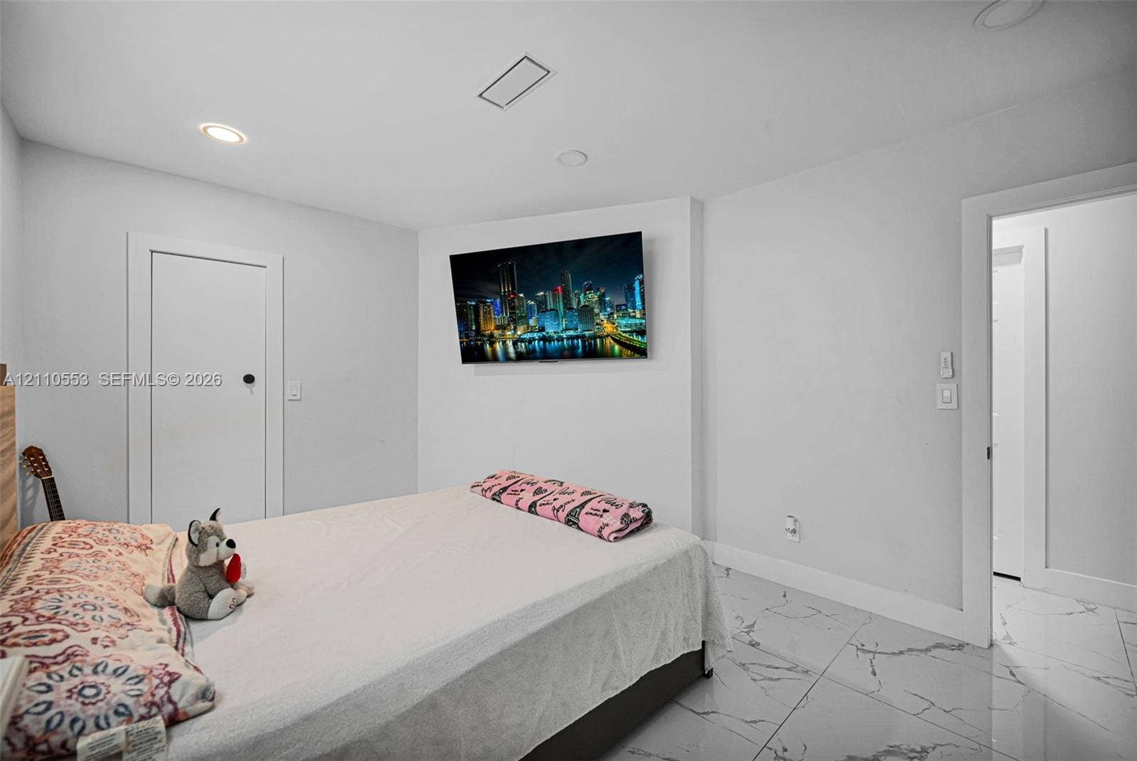16611 SW 108th Court, Miami, FL 33157 Neutral-toned interior featuring large-format stone-patterned tile flooring and recessed lighting