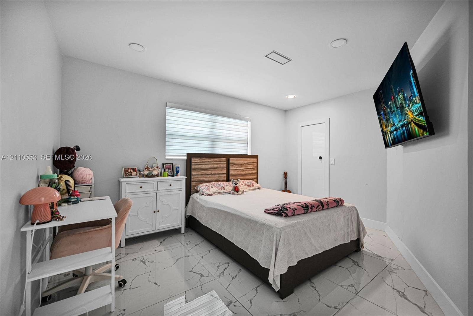 16611 SW 108th Court, Miami, FL 33157 Polished light-toned tile flooring with veining, recessed lighting, and a horizontal window treatment