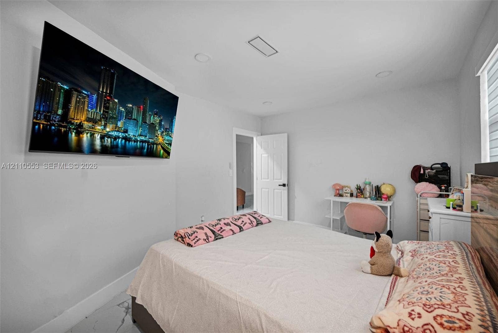 16611 SW 108th Court, Miami, FL 33157 Room featuring recessed lighting, stone-finish flooring, and a panel door with matte black hardware