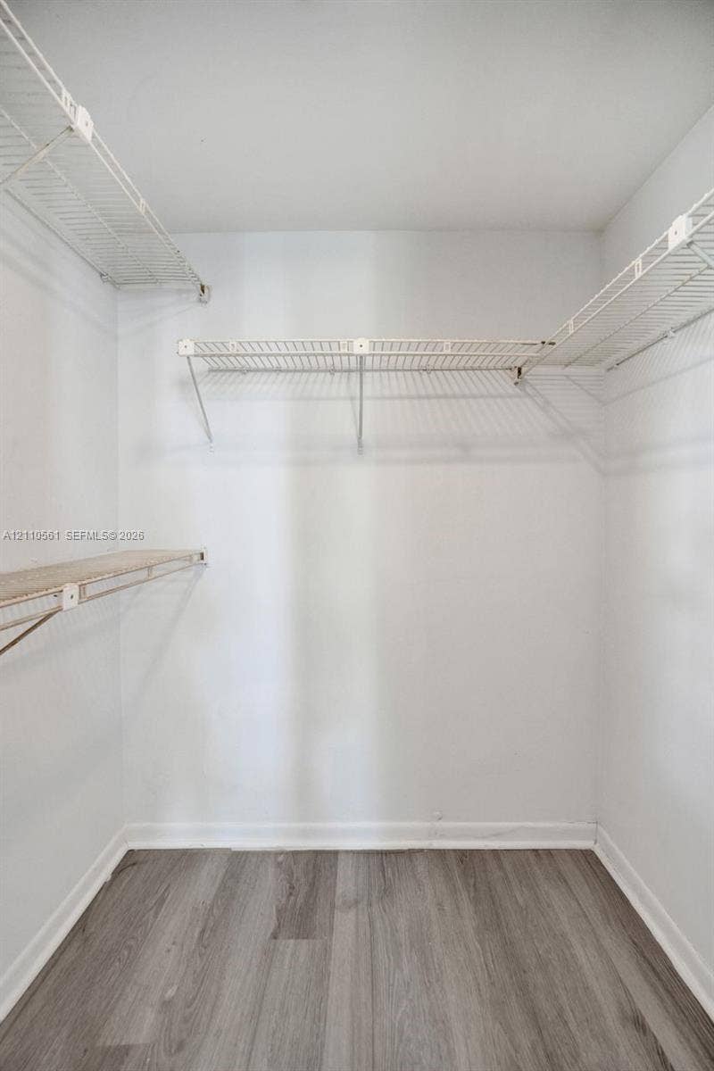 7950 W Mcnab Road, #222, Tamarac, FL 33321 Storage space featuring multi-level white wire shelving and wood-finish flooring
