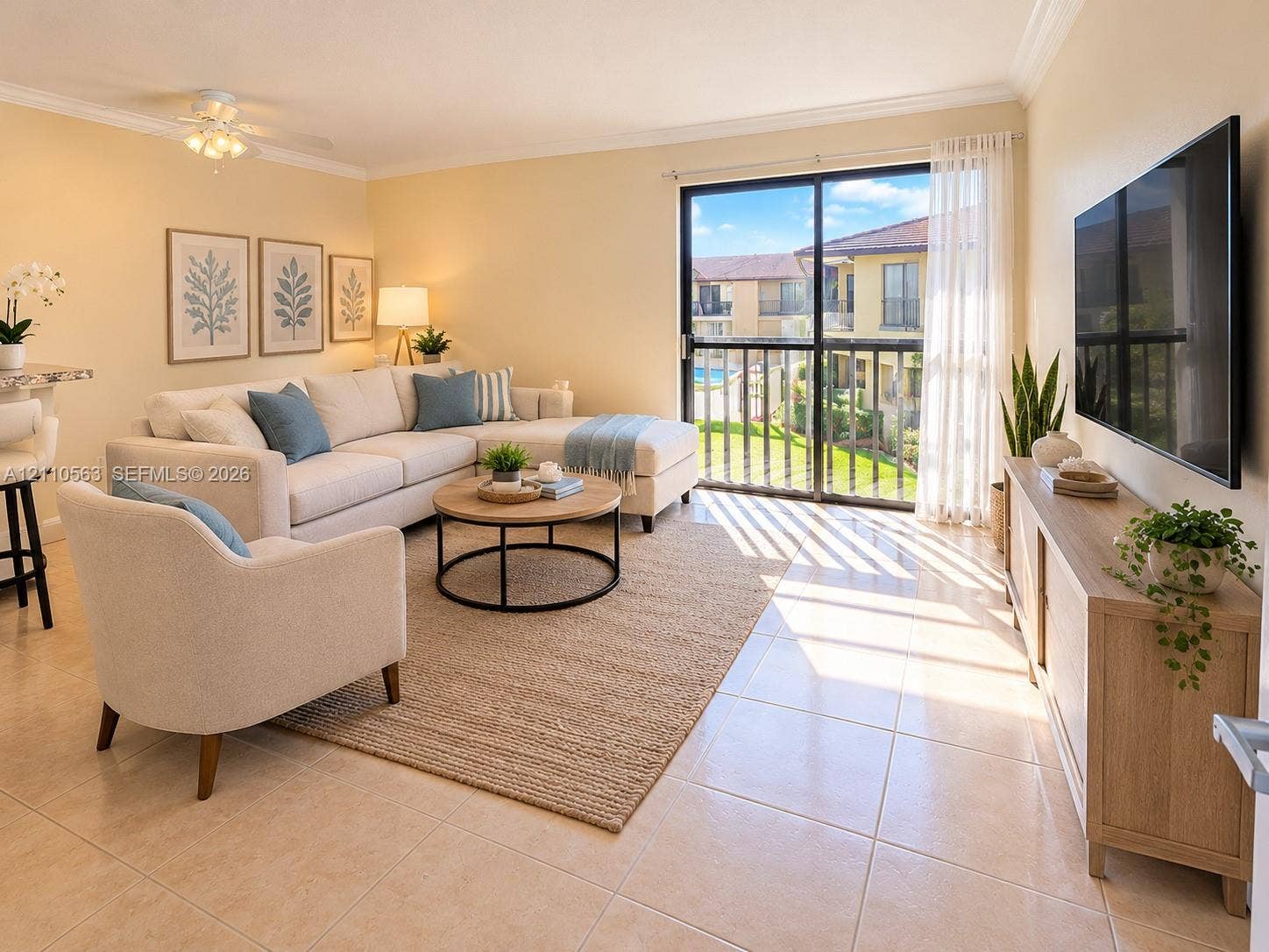 Ceramic tile flooring, crown molding, and a ceiling fan with light fixture