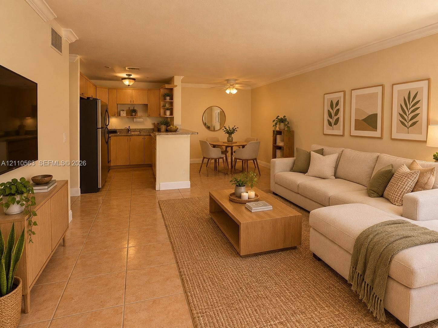Open-concept living space featuring ceramic tile flooring, kitchen with peninsula seating, wood cabinetry, and recessed lighting
