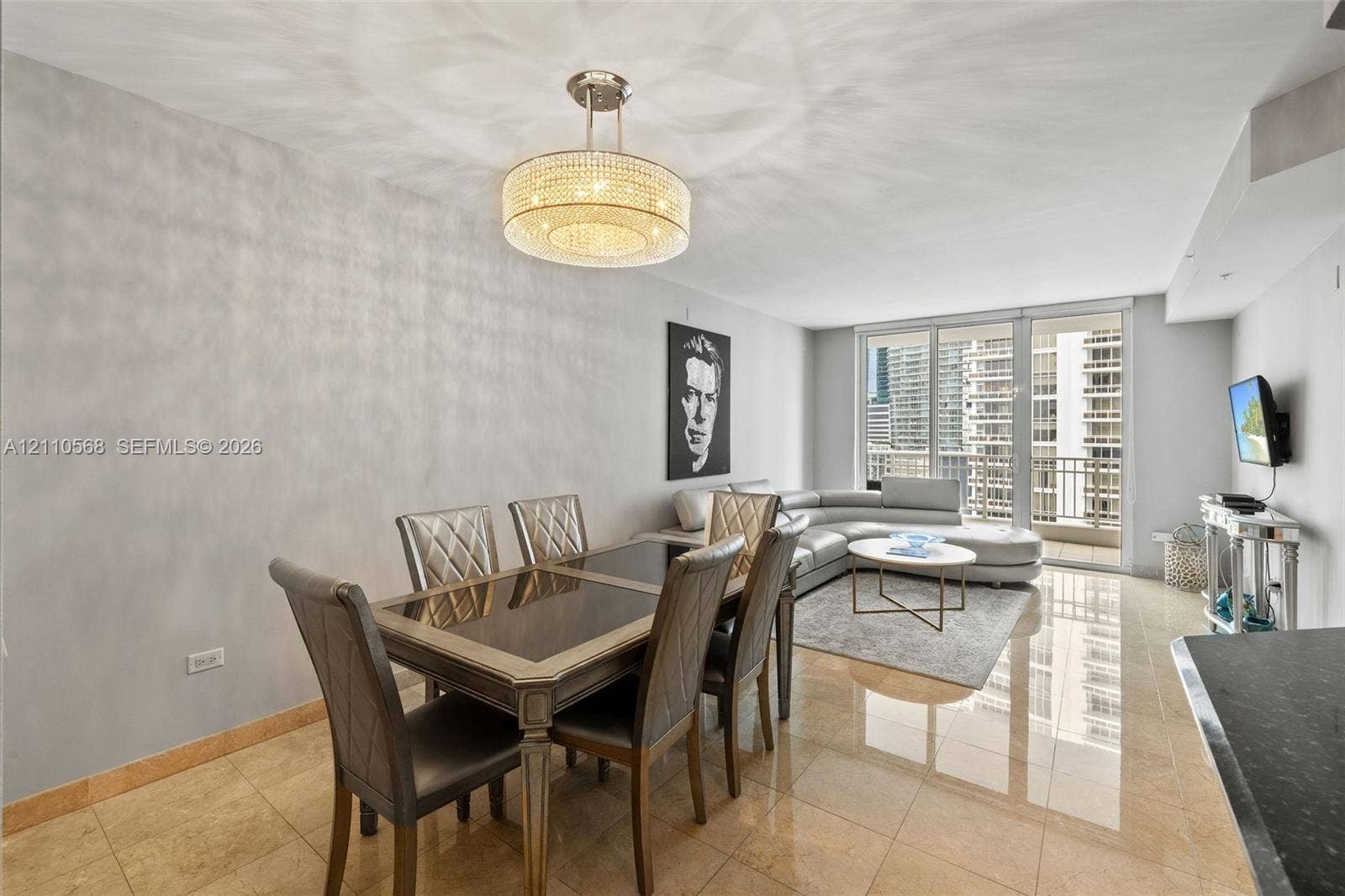 801 Brickell Key Boulevard, #2006, Miami, FL 33131 Polished stone flooring, crystalline drum chandelier, and full-height glass balcony doors