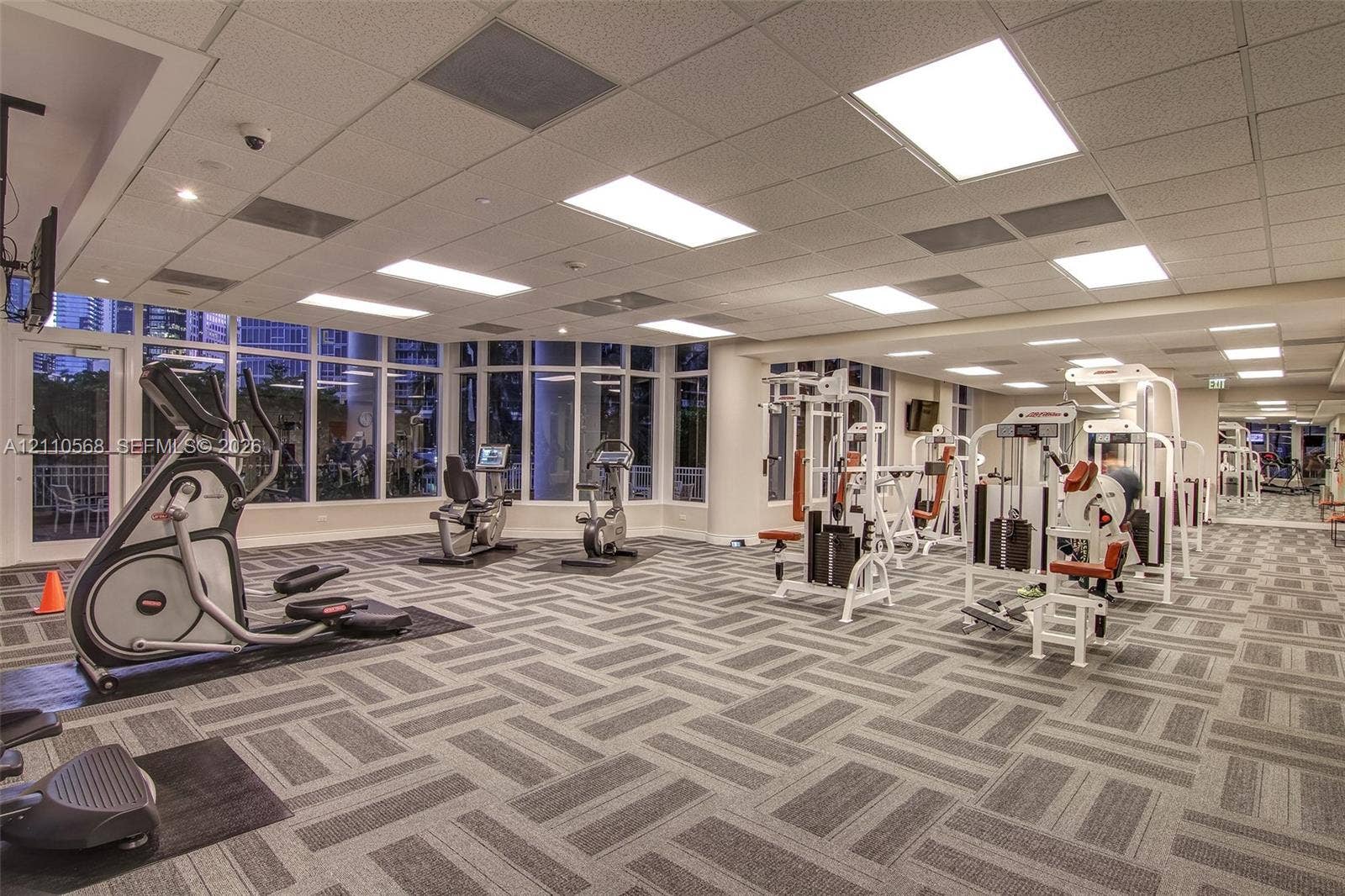 801 Brickell Key Boulevard, #2006, Miami, FL 33131 Fitness center featuring floor-to-ceiling windows, patterned carpeting, and recessed ceiling lighting