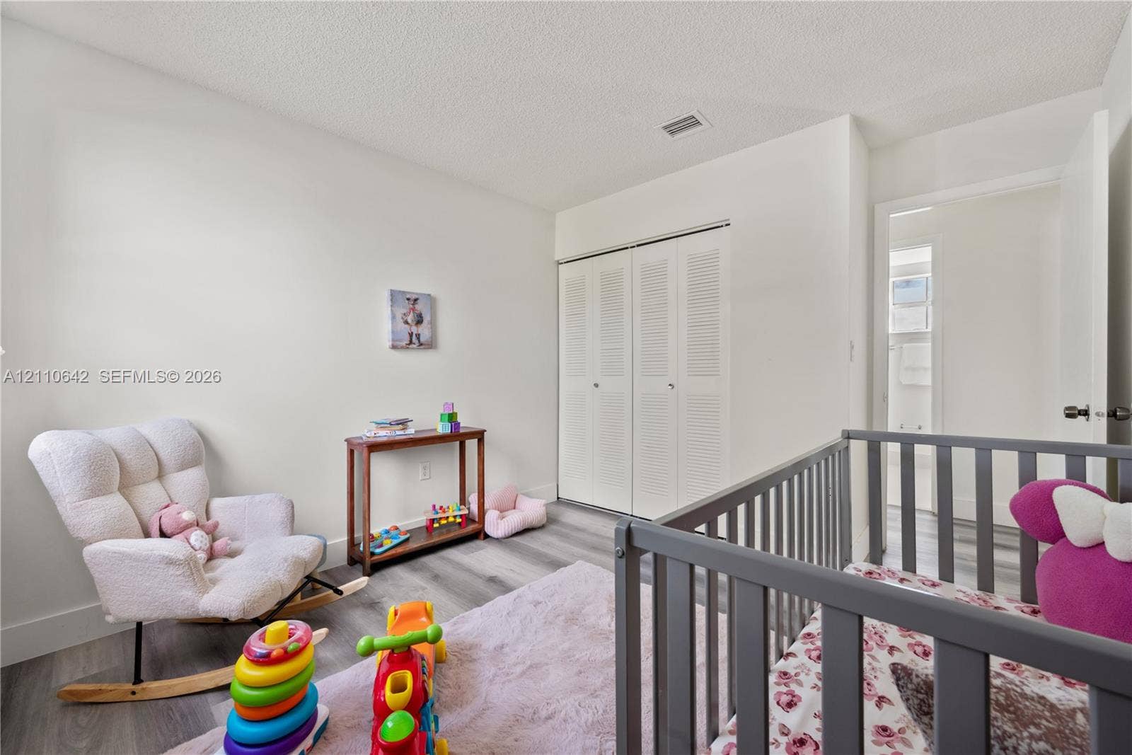 14732 SW 90th Terrace, Miami, FL 33196 Interior room featuring wood-finish flooring and double bi-fold louvered closet doors