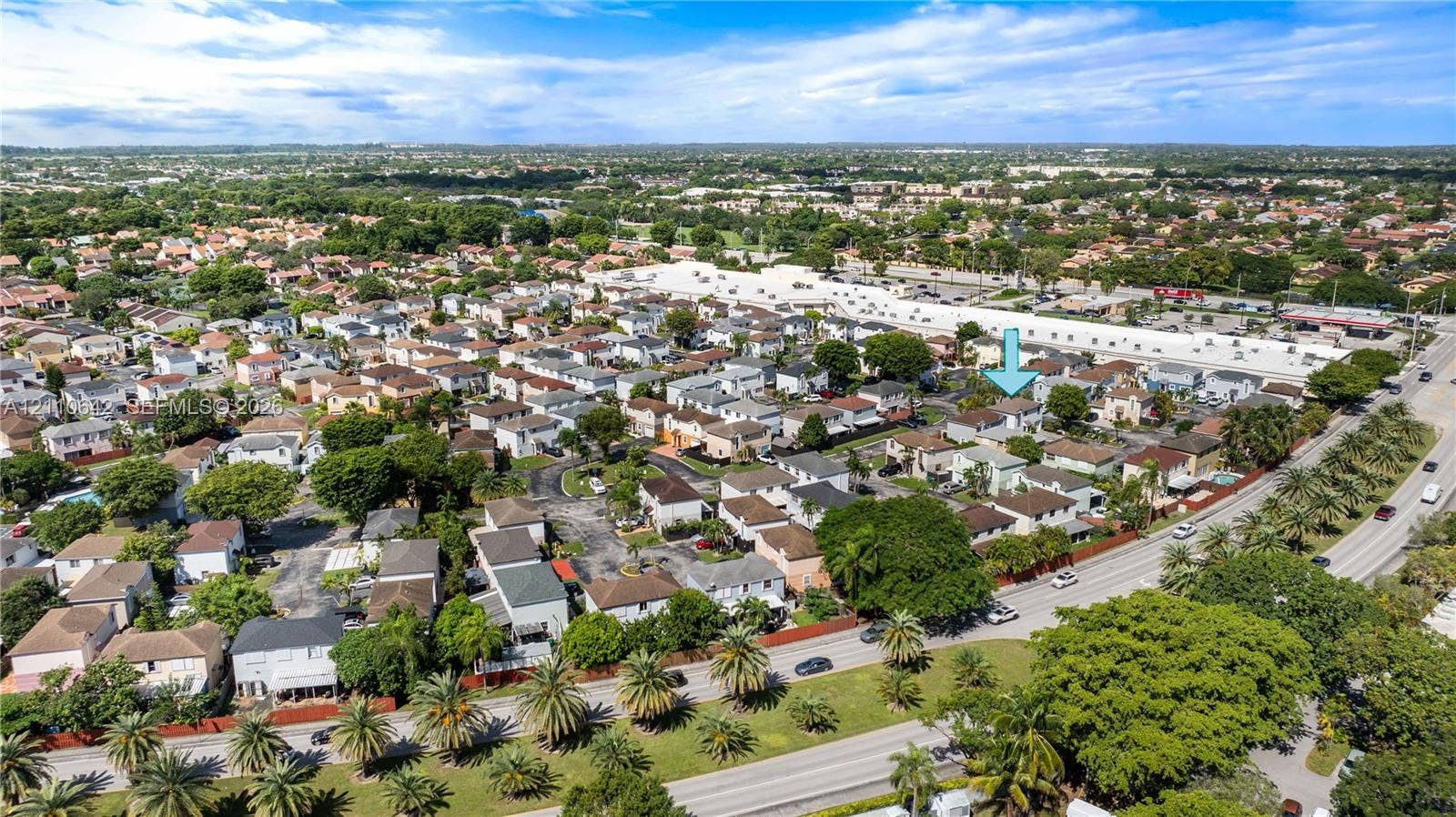 14732 SW 90th Terrace, Miami, FL 33196 Aerial perspective of a suburban neighborhood featuring residential housing, mature tree canopy coverage, expansive green spaces, and proximity to major thoroughfares