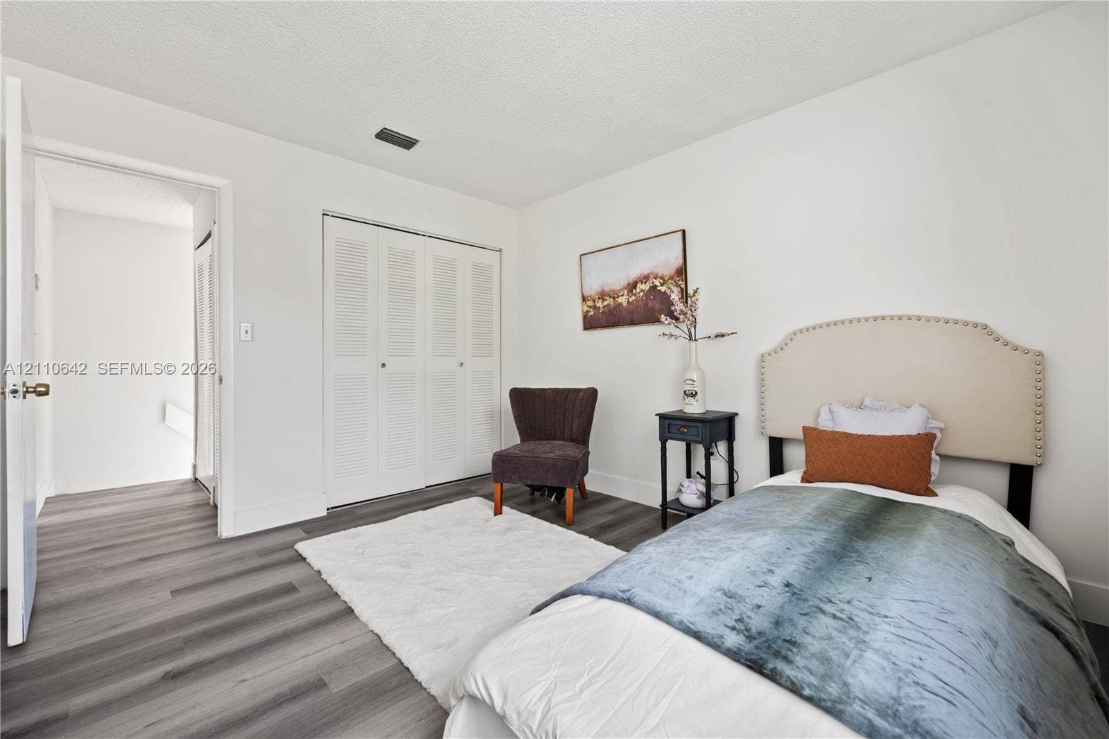 14732 SW 90th Terrace, Miami, FL 33196 Wood-finish flooring and closet with louvered double doors