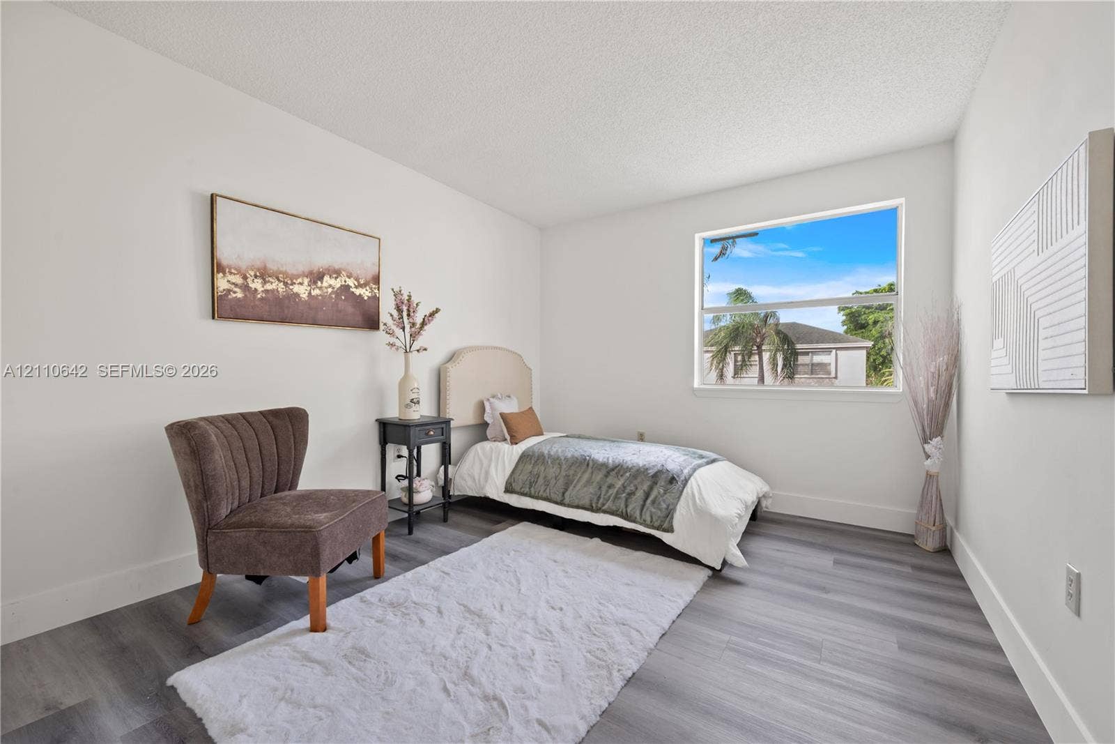 14732 SW 90th Terrace, Miami, FL 33196 Bedroom featuring wood-finish flooring, white walls, and a large window
