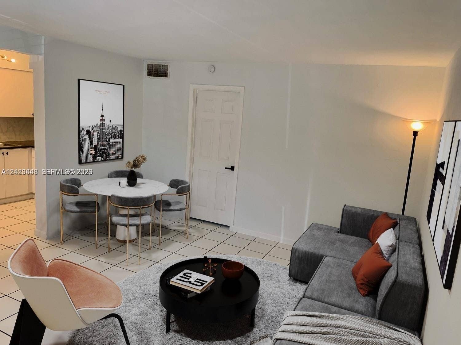 Open-concept interior featuring neutral wall tones and uniform tile flooring