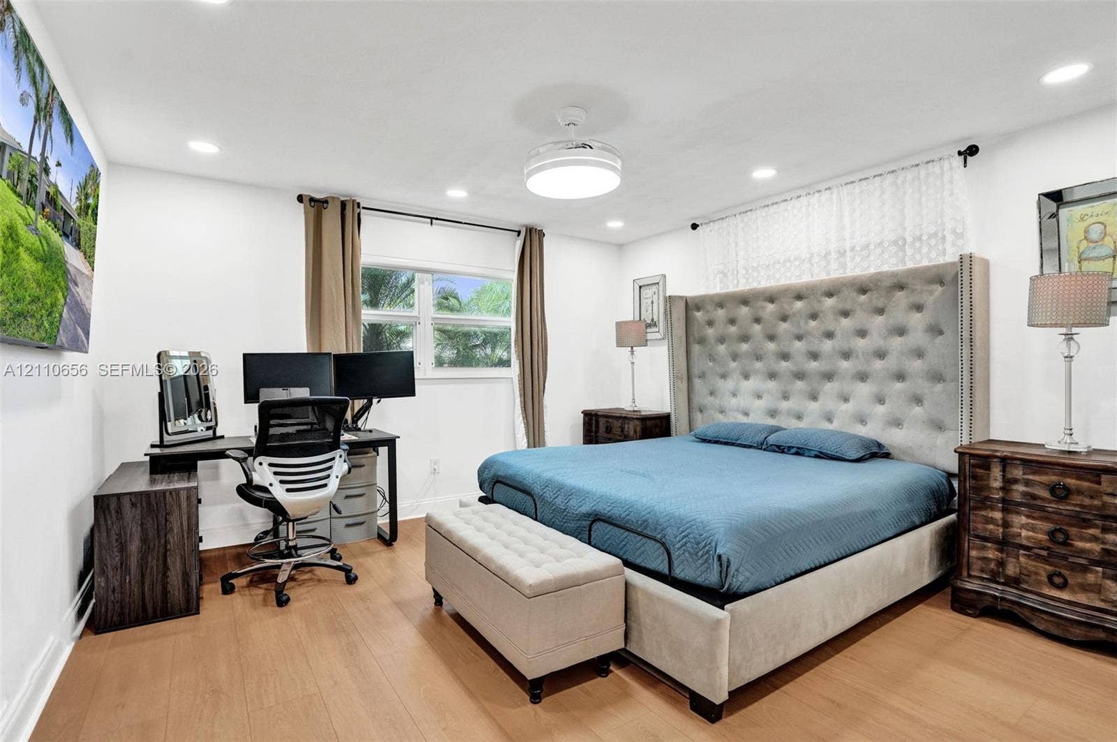 30 NE 48th Court, Oakland Park, FL 33334 Wood-finish flooring, recessed lighting, and a centrally mounted ceiling fan fixture