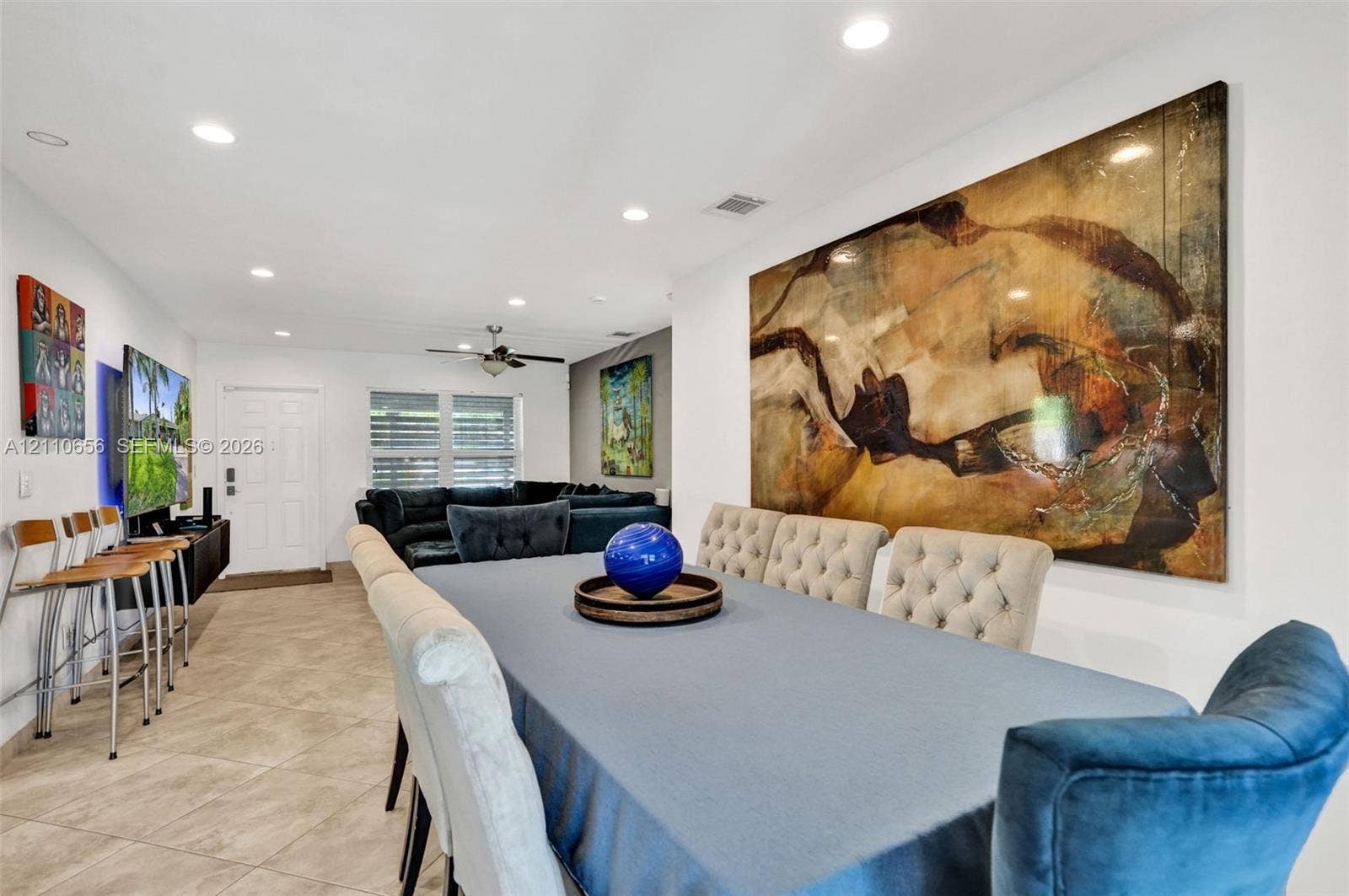 30 NE 48th Court, Oakland Park, FL 33334 Large interior space featuring neutral tile flooring, recessed lighting, and a ceiling fan