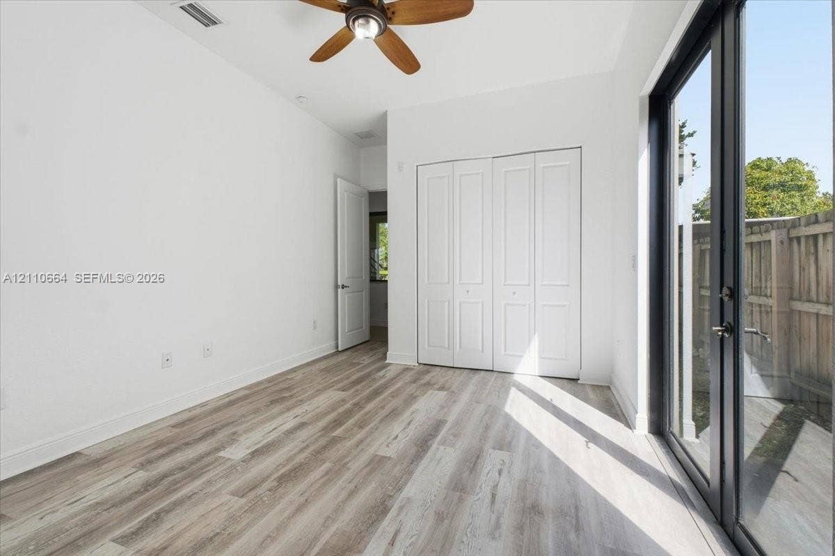 Versatile 1st floor bedroom with a private full bathroom, ideal for guests or a home office.