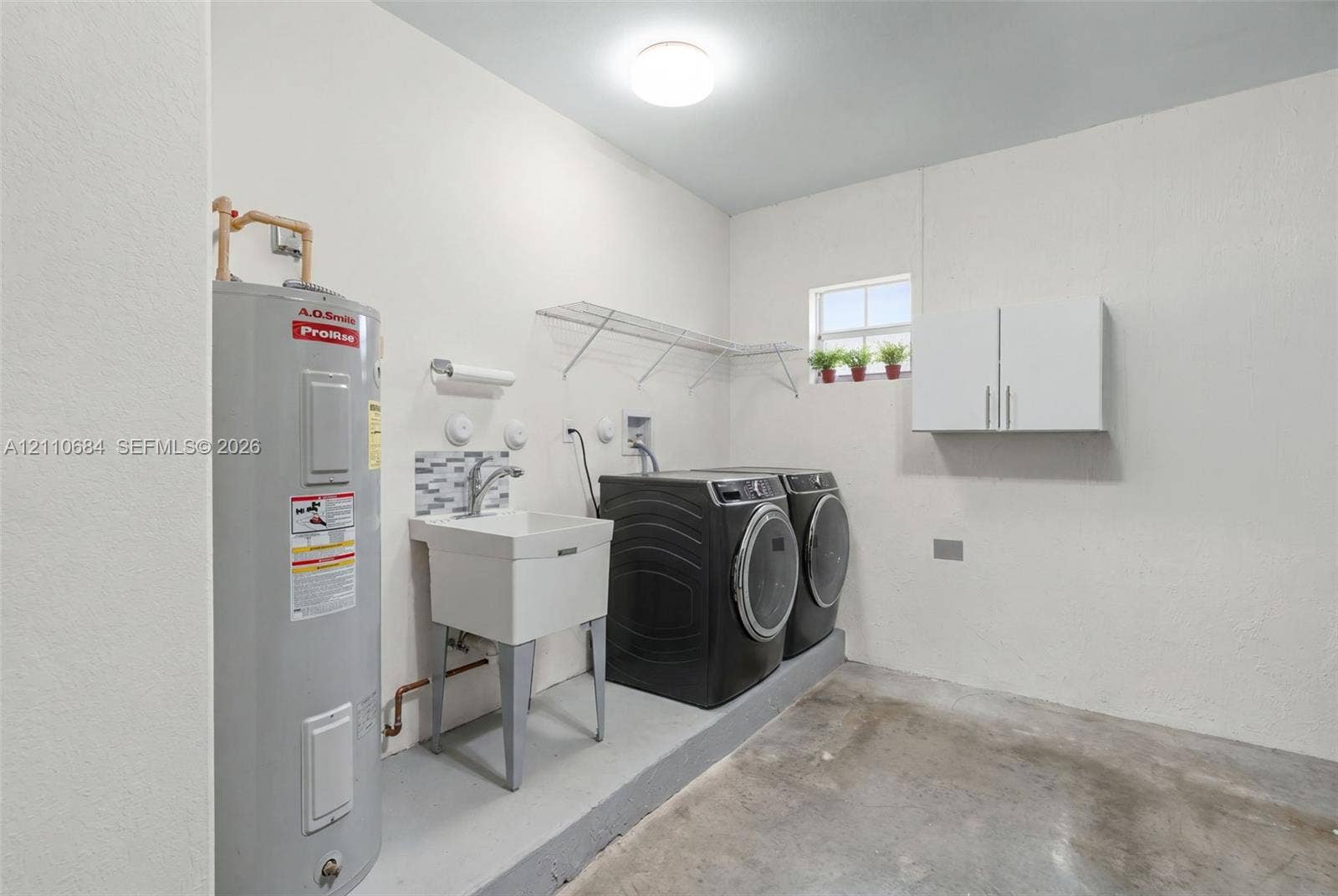 13542 SW 177th Terrace, Miami, FL 33177 Laundry area with utility sink