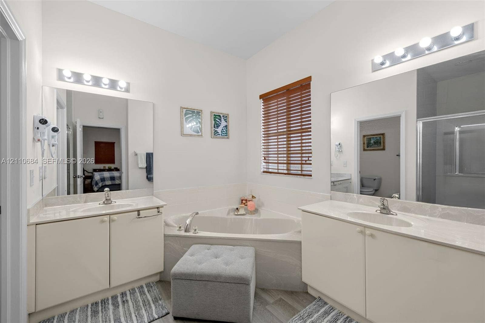 13542 SW 177th Terrace, Miami, FL 33177 Dual vanities featuring solid-surface countertops, integrated sinks, and polished chrome hardware