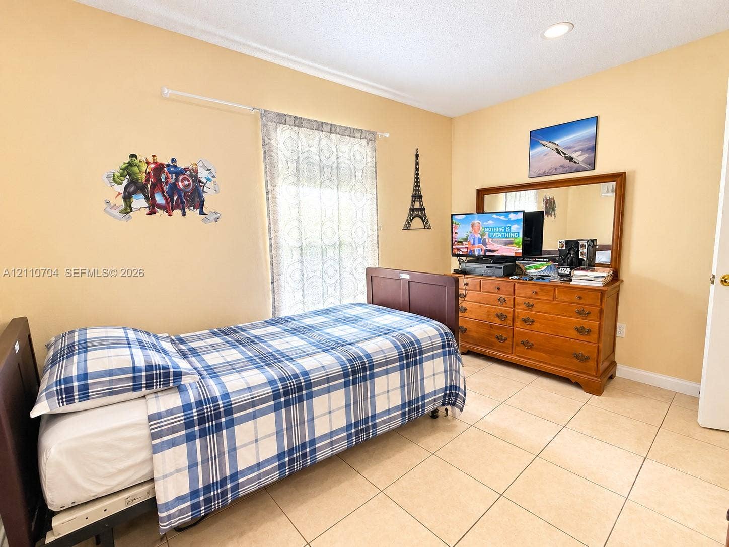 Interior room featuring large-format ceramic tile flooring, neutral wall paint, and recessed lighting