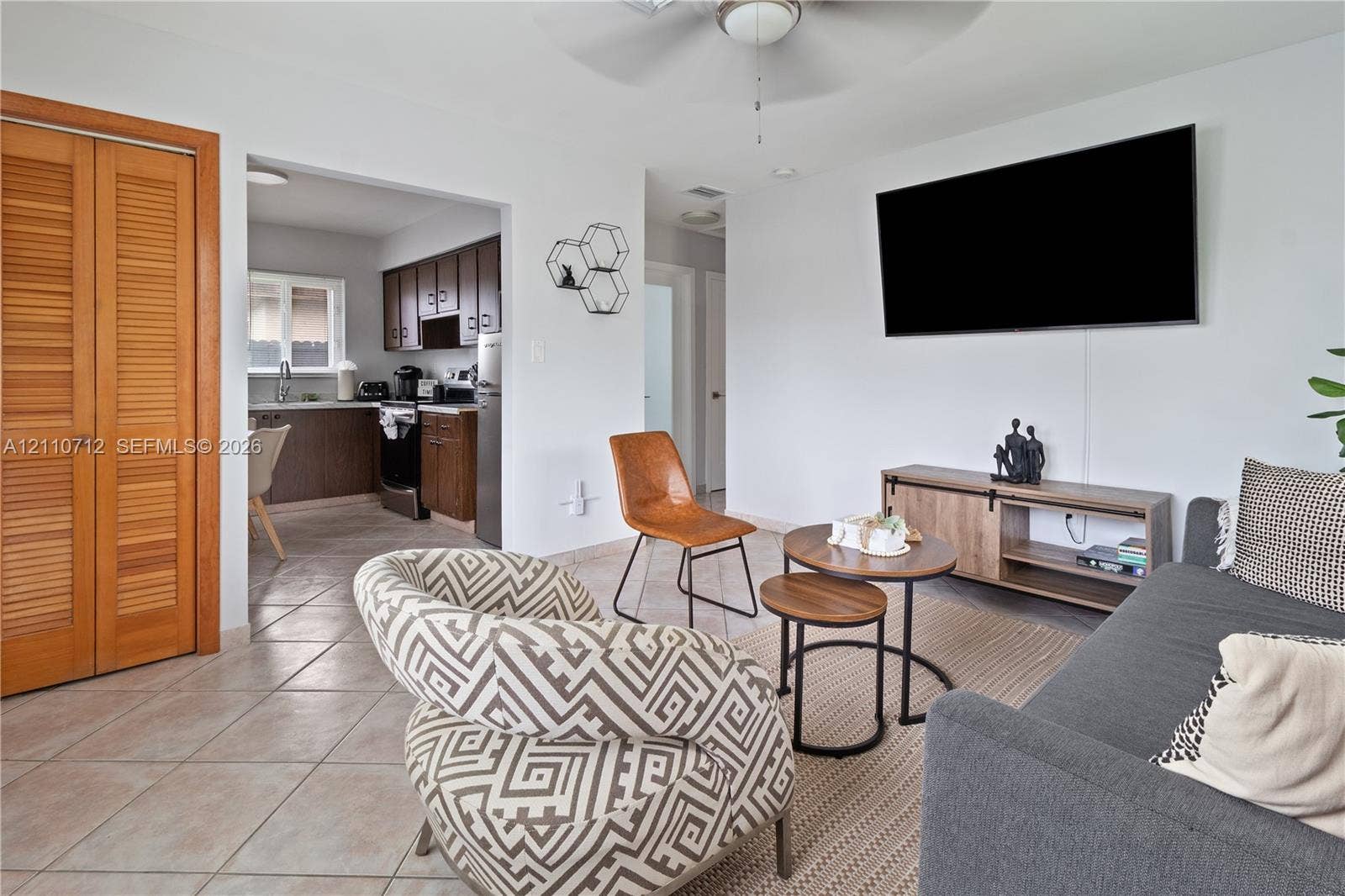 Ceramic tile flooring, louvered wood closet doors, and recessed ceiling lighting
