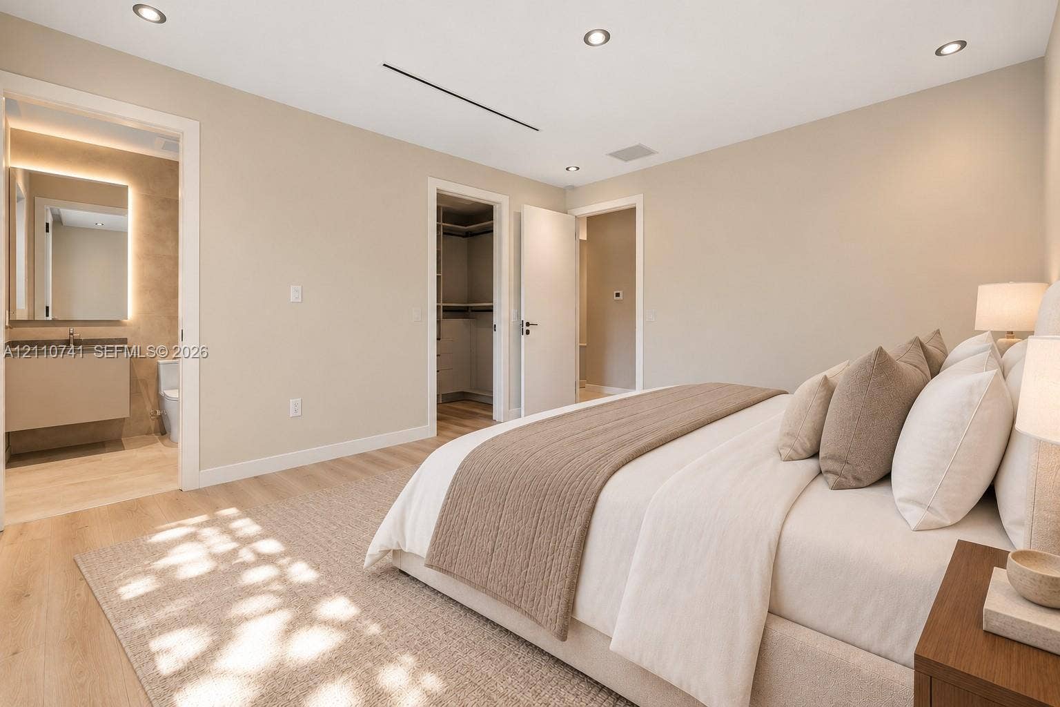 9445 SW 73rd Avenue, Pinecrest, FL 33156 bedroom with en-suite, virtually staged for illustrative purposes
