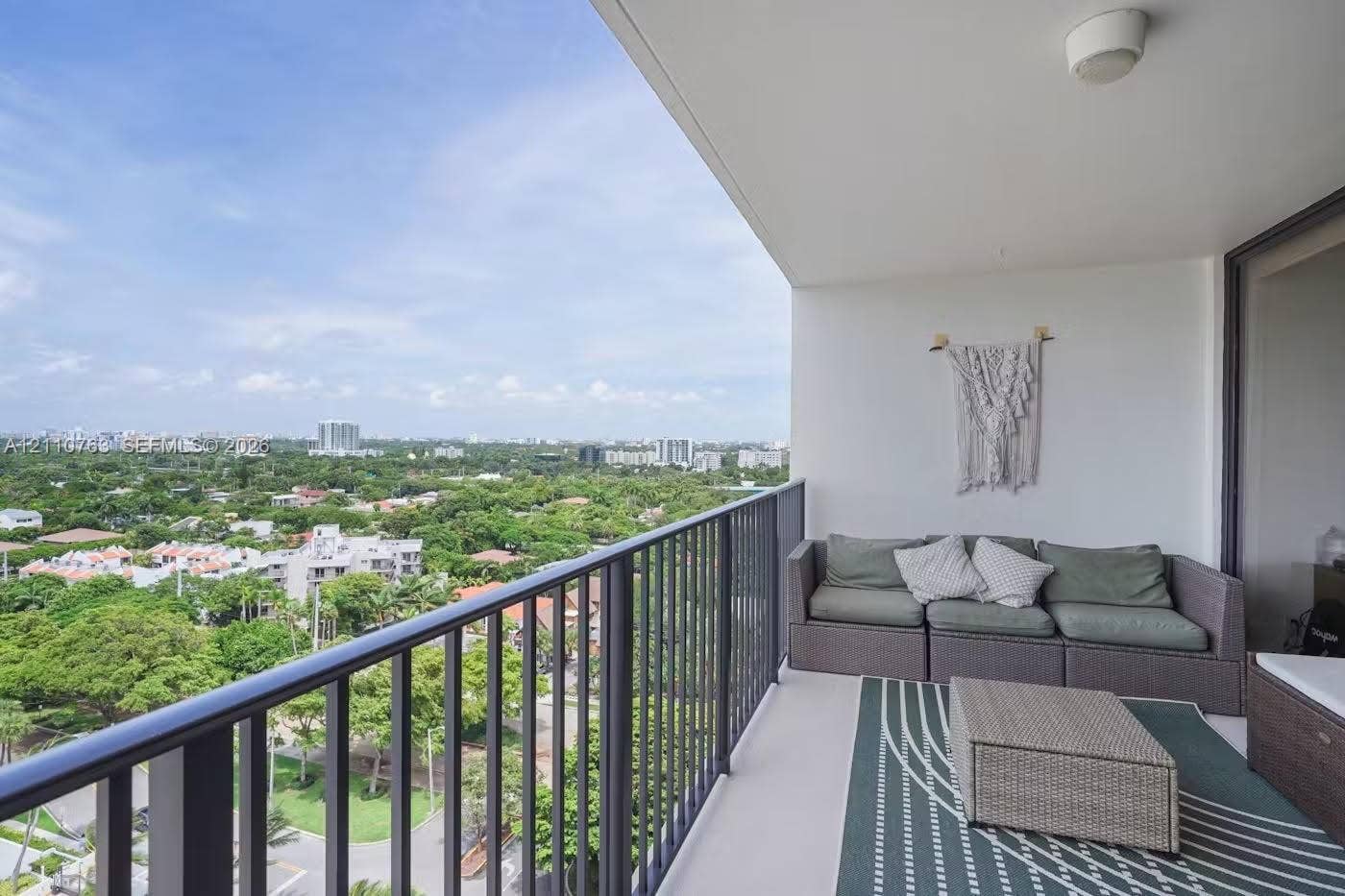 1901 Brickell Avenue, #B1706, Miami, FL 33129 Covered balcony featuring metal railings and a concrete floor