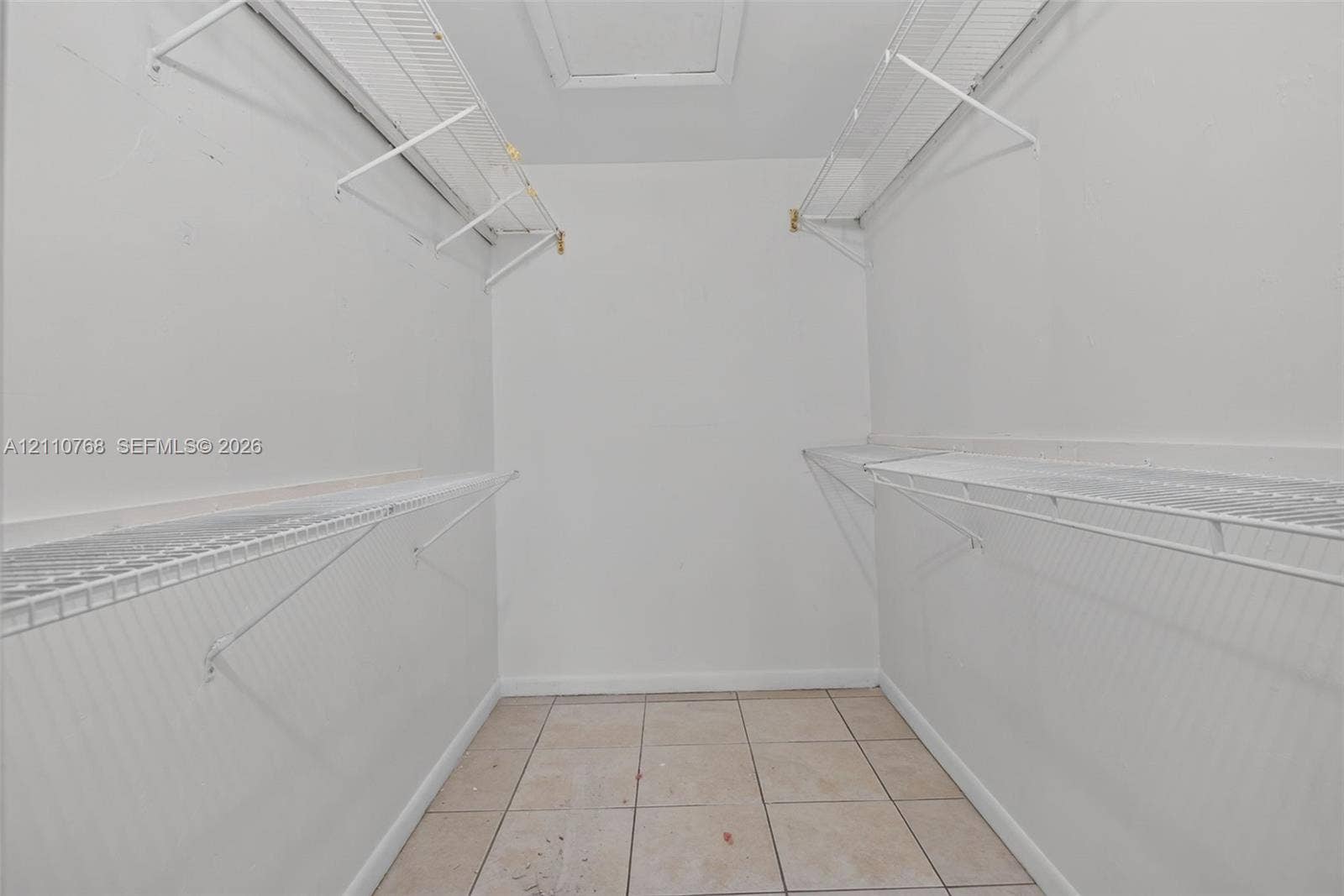 2070 NW 43rd Terrace, #7, Lauderhill, FL 33313 Walk-in storage space featuring ceramic tile flooring and multi-level white wire shelving