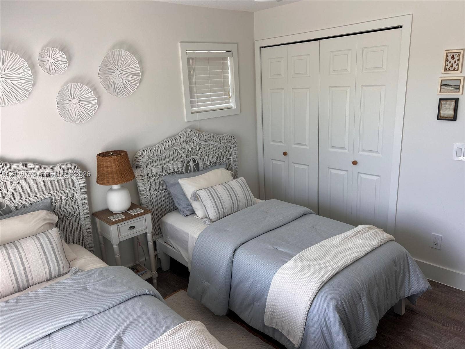 4995 S Highway A1a, #D, Melbourne Beach, FL 32951 Neutral wall finish, double-panel closet doors, and wood-finish flooring