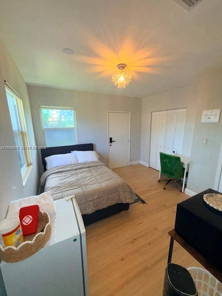201 Flagler Drive, #201, Miami Springs, Miami Springs, FL 33166 Wood-finish flooring, dual windows, recessed lighting fixture, and white bifold closet doors
