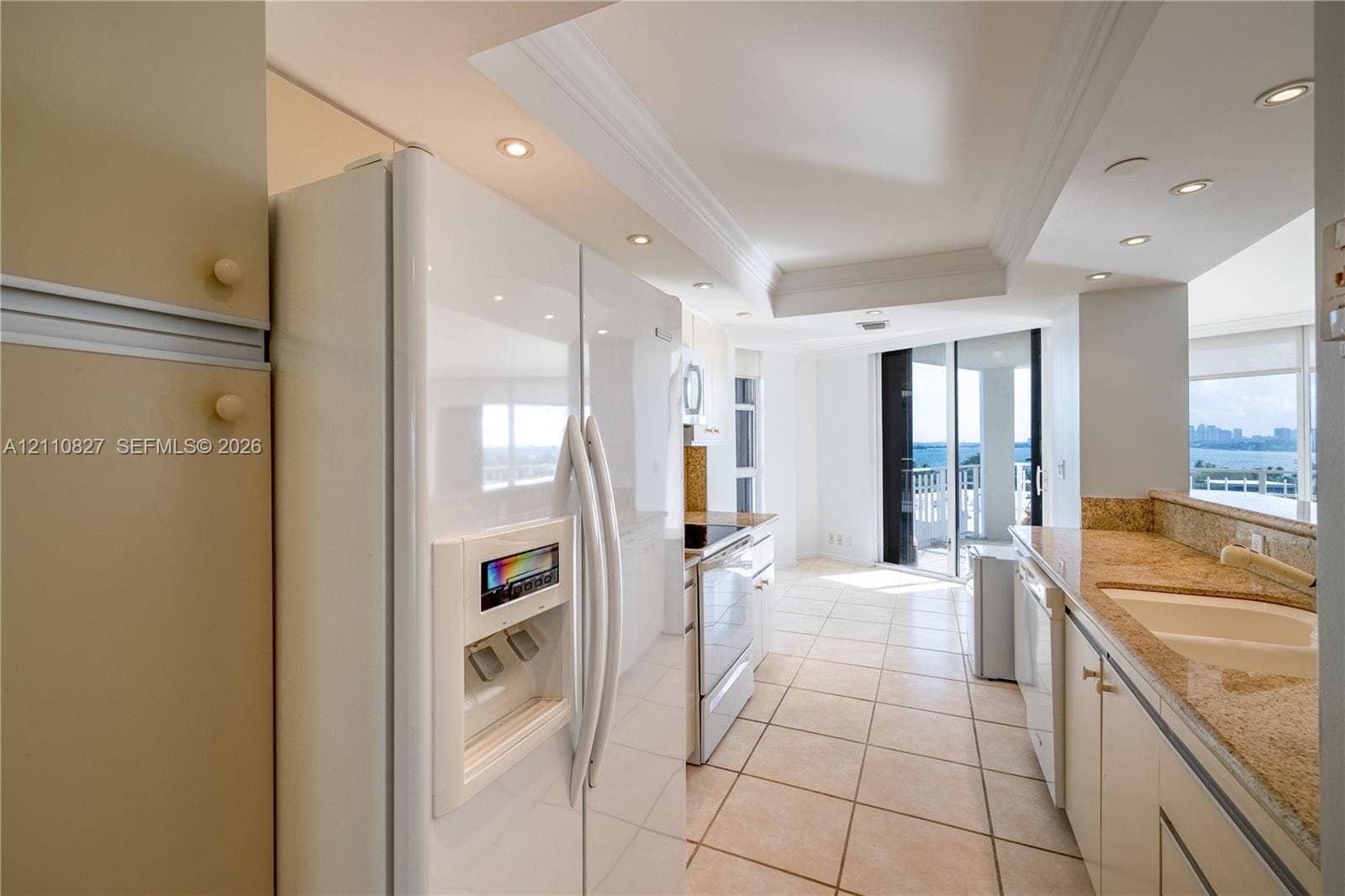 4000 Towerside Terrace, #908, Miami, Miami, FL 33138 Kitchen featuring recessed lighting, stone countertops, integrated cabinetry, white appliances, and ceramic tile flooring