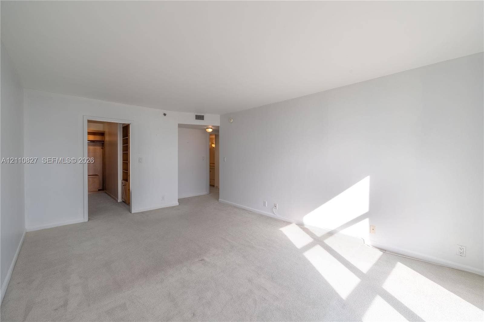 4000 Towerside Terrace, #908, Miami, Miami, FL 33138 Neutral-toned wall paint, neutral carpeting, and recessed ceiling lighting