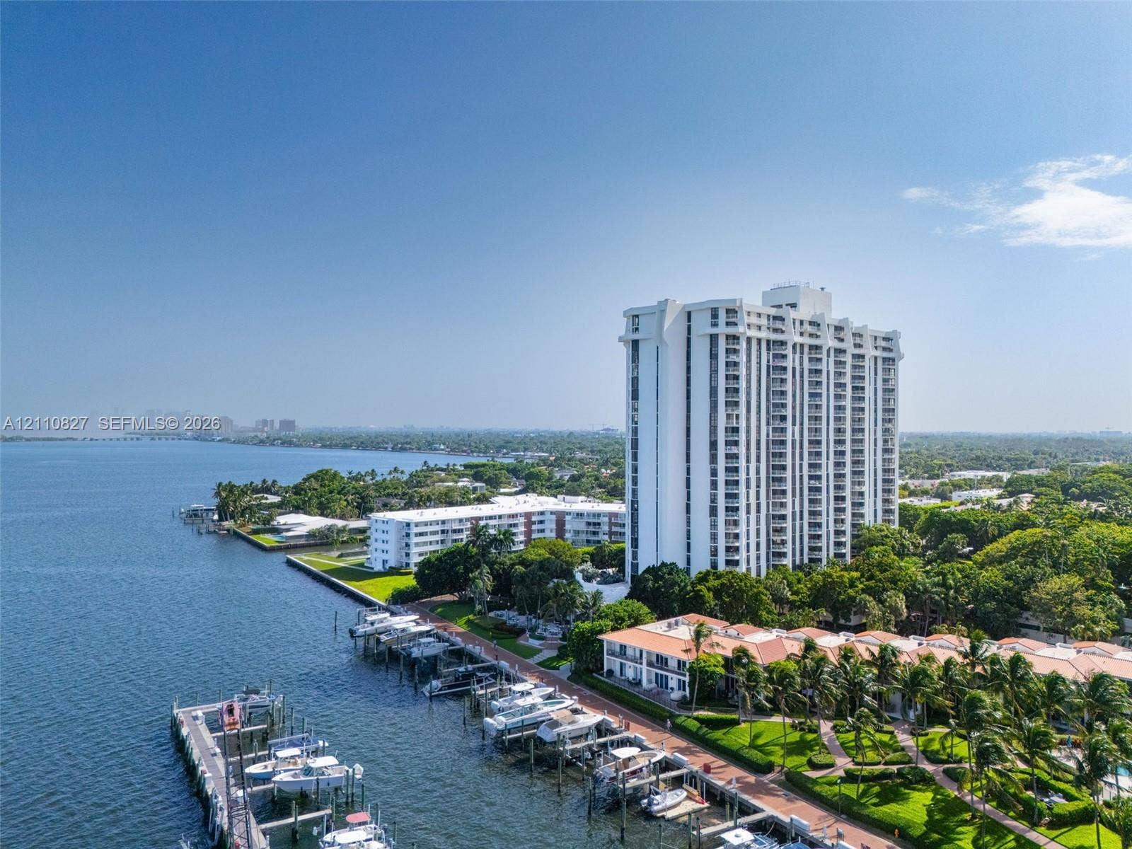 4000 Towerside Terrace, #908, Miami, Miami, FL 33138 High-rise residential building featuring private boat slips, manicured landscaping, paved walkways, and direct water frontage