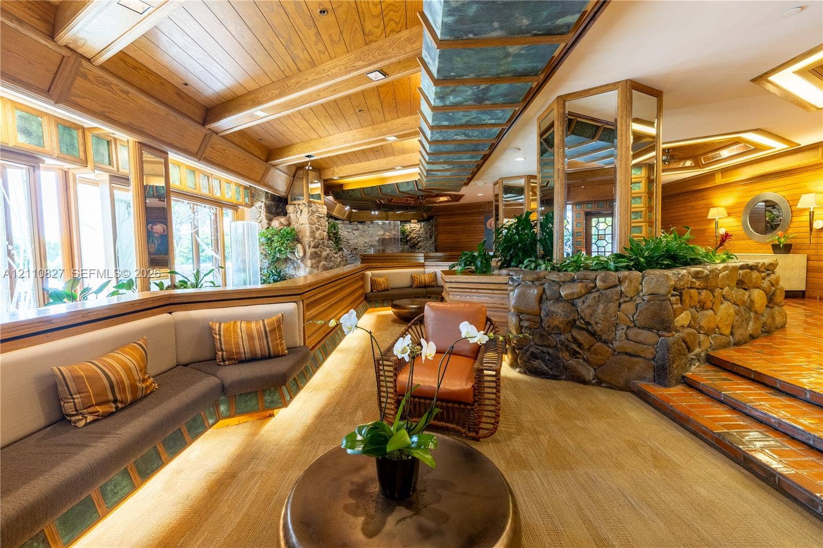 4000 Towerside Terrace, #908, Miami, Miami, FL 33138 Vaulted wood-paneled ceiling, integrated stone masonry walls, built-in recessed seating, and terra-cotta tile flooring