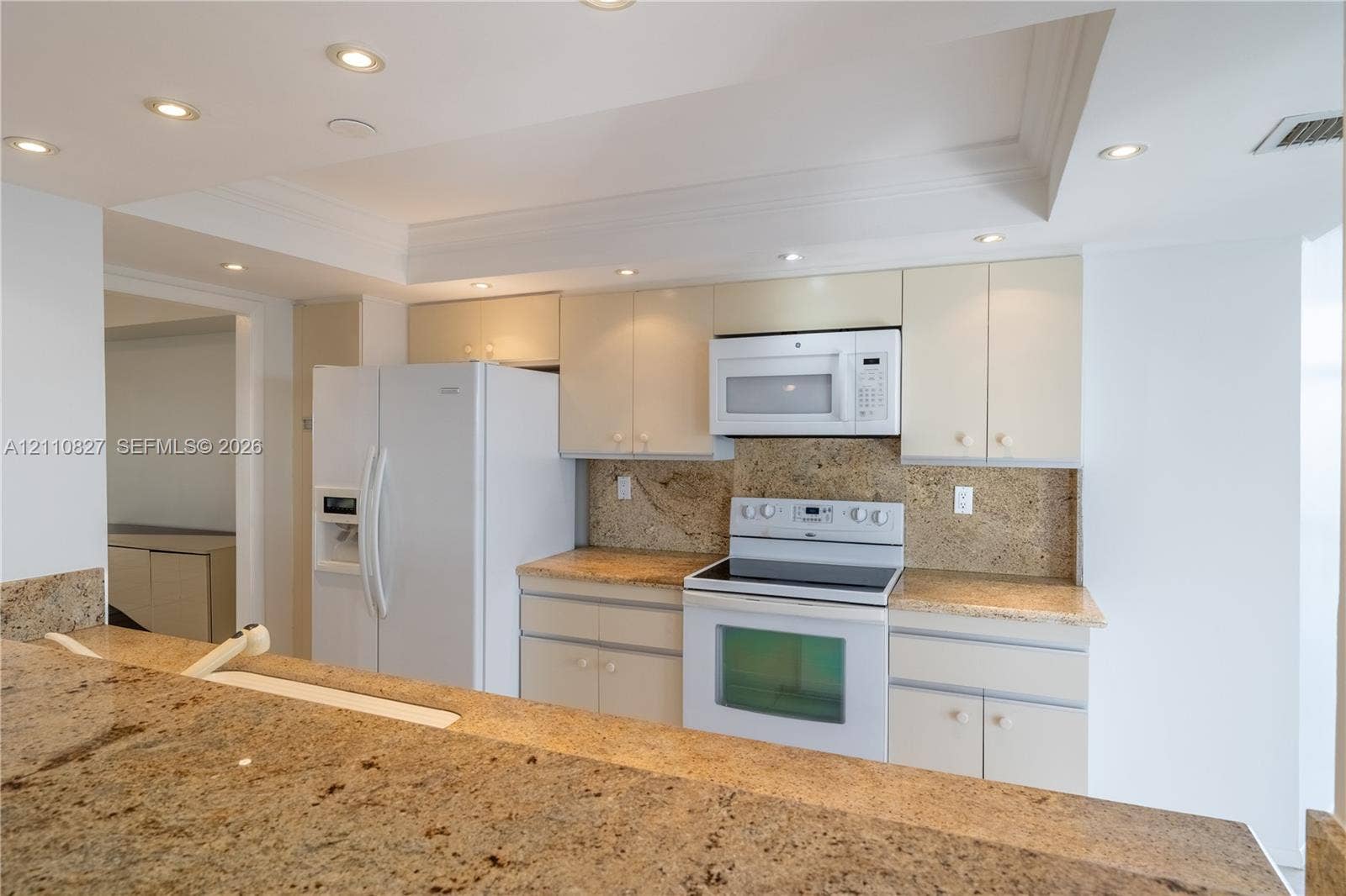 4000 Towerside Terrace, #908, Miami, Miami, FL 33138 Kitchen featuring stone countertops, integrated cabinetry, white appliances, and recessed ceiling lighting