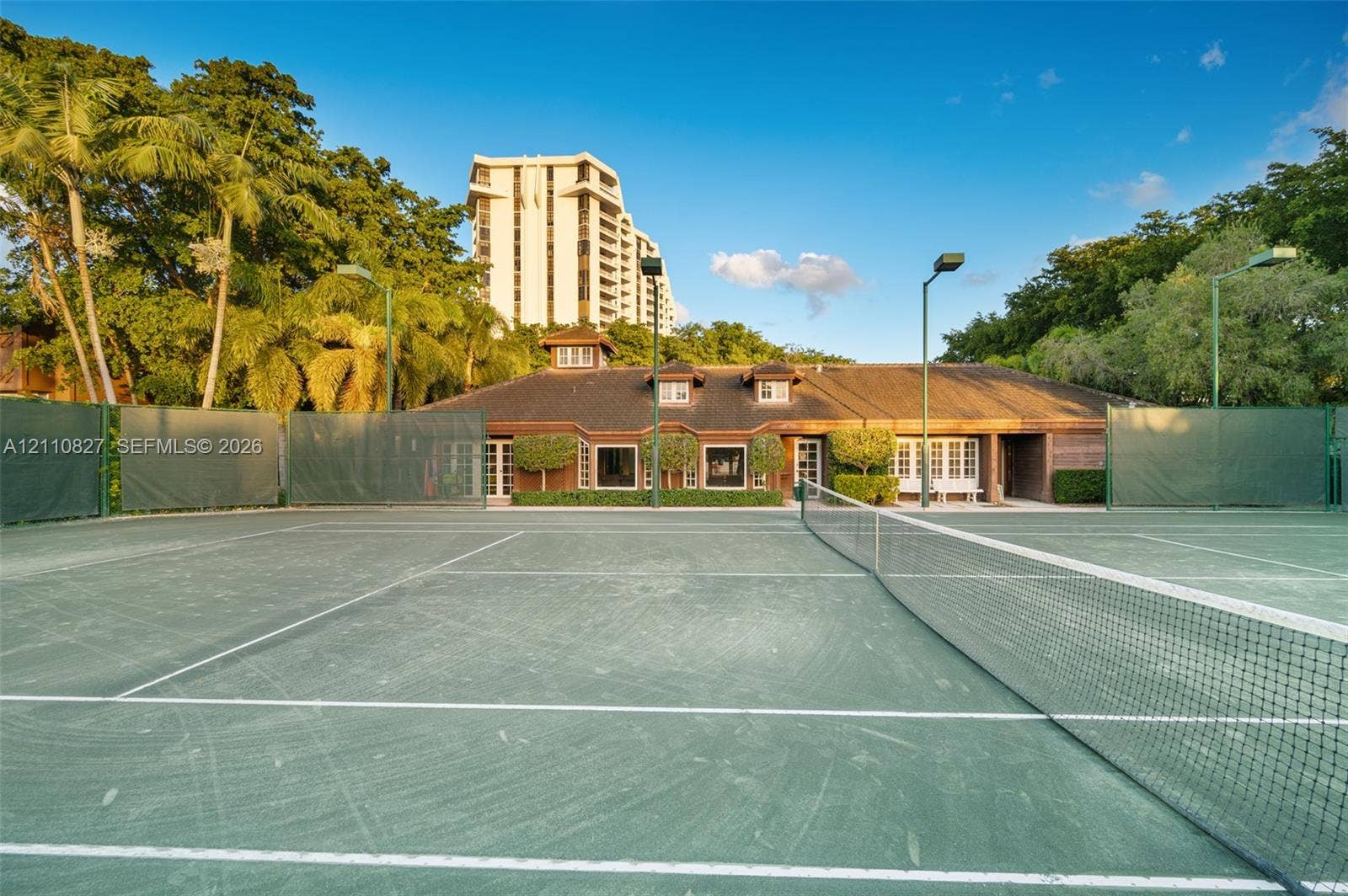 4000 Towerside Terrace, #908, Miami, Miami, FL 33138 Tennis court featuring a hard surface, perimeter fencing, and integrated court lighting