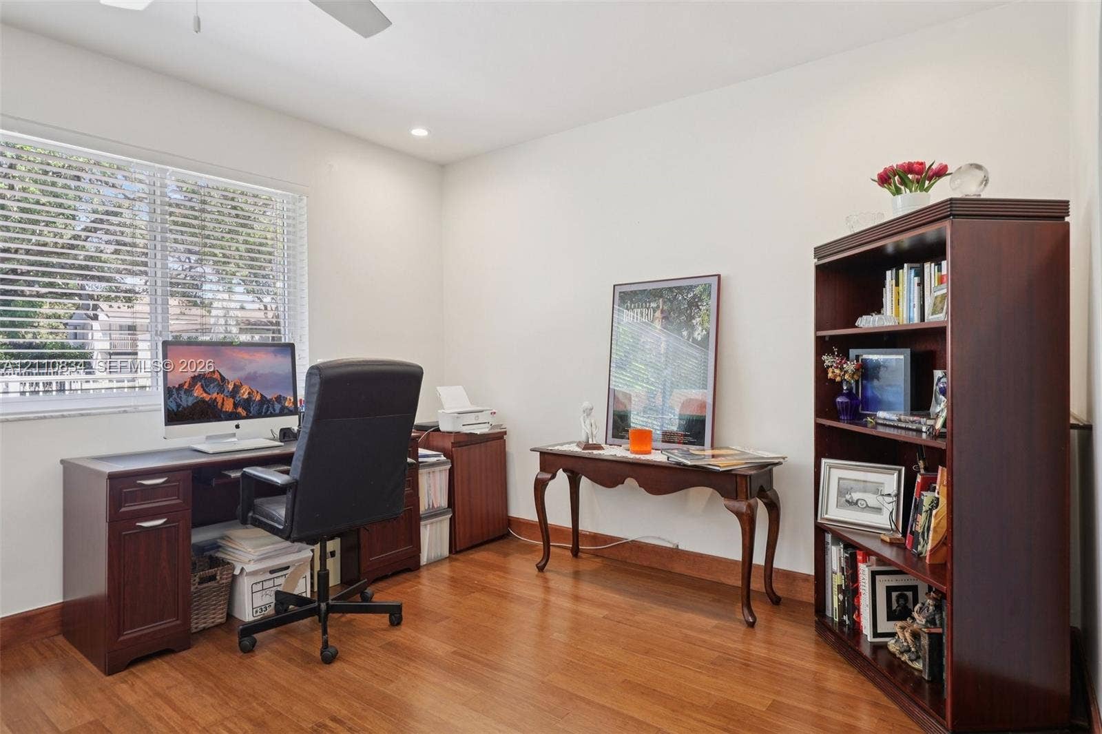 4120 SW 15th Street, Miami, FL 33142 Wood-finish flooring, large window with horizontal blinds, and recessed ceiling lighting