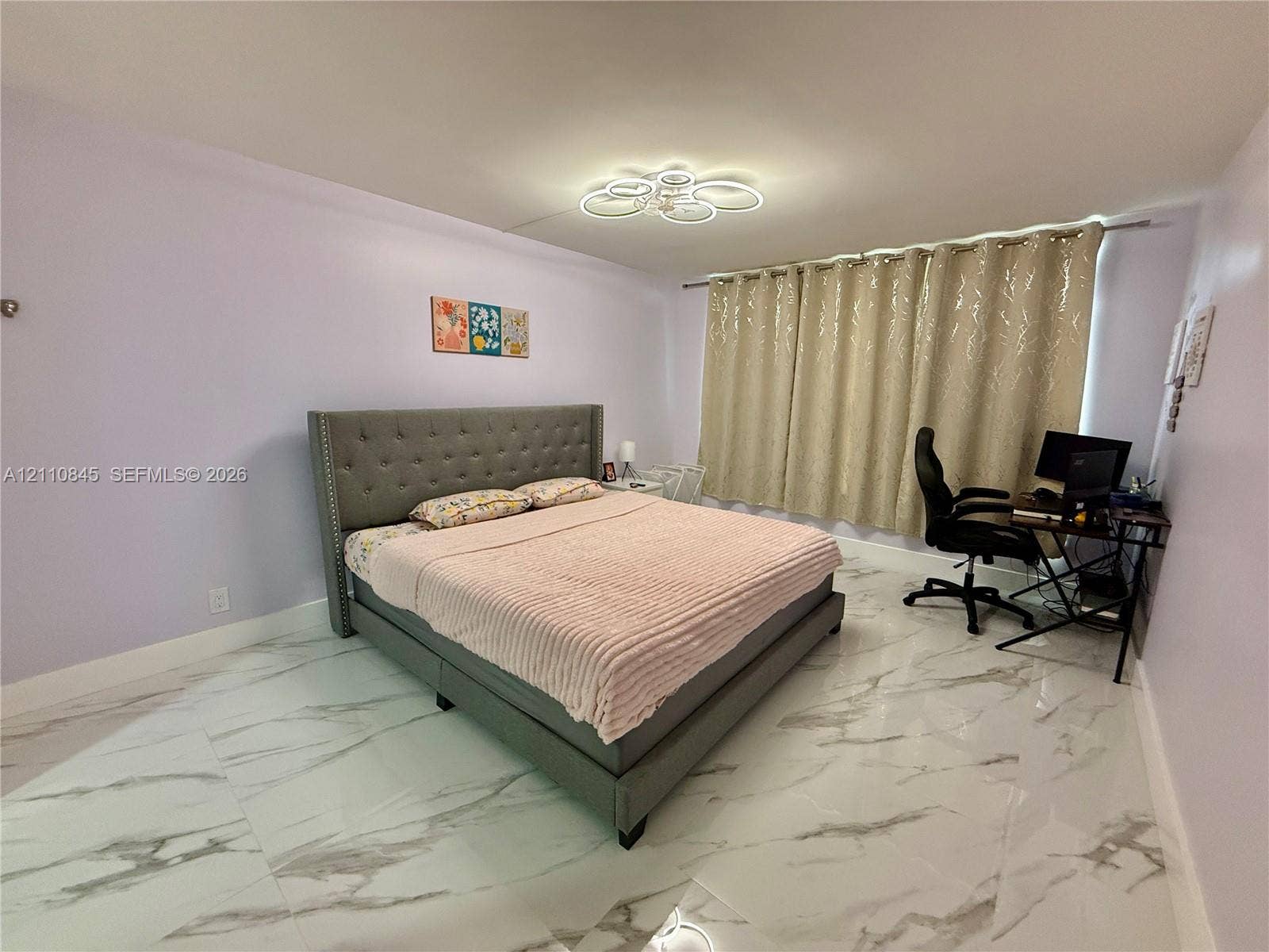 565 Oaks Lane, #410, Pompano Beach, FL 33069 Polished large-format floor tile with stone-patterned veining and modern circular flush-mount ceiling lighting