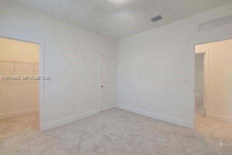 17552 SW 46th Street, Miramar, Miramar, FL 33029 Neutral-toned carpeting, high ceilings, solid-core interior doors, and walk-in closet with built-in wire shelving