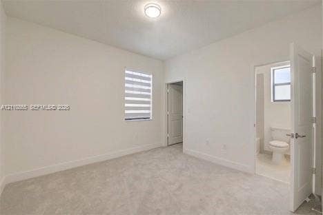 17552 SW 46th Street, Miramar, Miramar, FL 33029 Neutral-toned wall-to-wall carpeting, dual-tone roller shade, flush-mount ceiling lighting, and solid-core interior doors