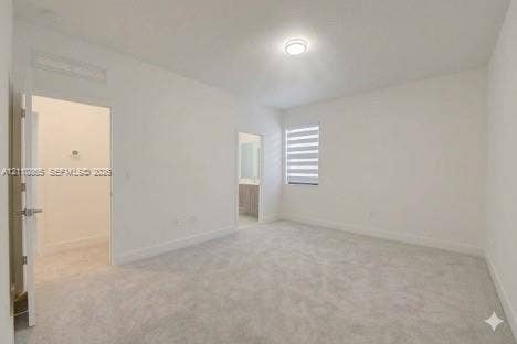 17552 SW 46th Street, Miramar, Miramar, FL 33029 Neutral-toned carpeted flooring, flush-mount ceiling lighting, and layered window blinds