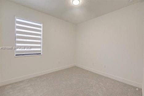 17552 SW 46th Street, Miramar, Miramar, FL 33029 Neutral-toned wall paint, plush carpeting, ceiling-mounted light fixture, and dual-layer privacy window shades