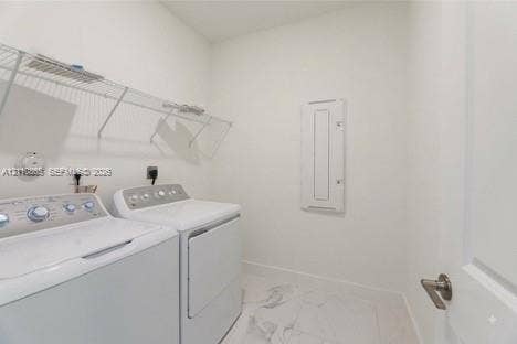 17552 SW 46th Street, Miramar, Miramar, FL 33029 Utility area featuring white-finish tile flooring, wall-mounted wire shelving, and a recessed electrical panel