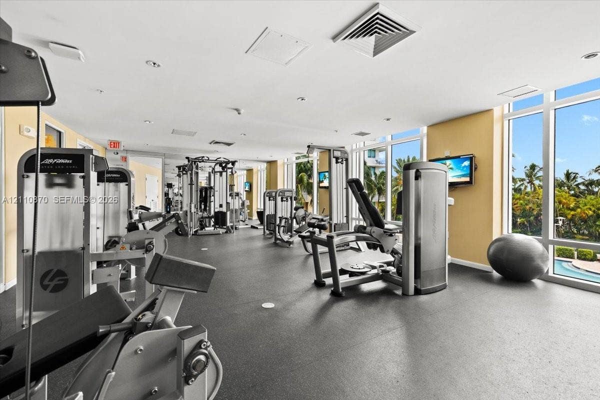 1755 E Hallandale Beach Boulevard, #MEZ5E, Hallandale Beach, FL 33009 Fitness center featuring floor-to-ceiling windows, rubberized flooring, and recessed lighting